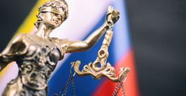 Statue of Justice against blurred background.