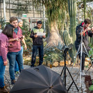 This image shows five students who are testing measurement methods in the Botanical Garden.