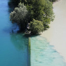 Confluence of Rhone and Arve, whitish water of Arve mixing with clear water of the Rhone, view from above