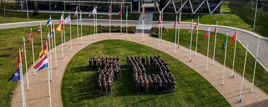 NATO turned 70 in 2025. Uniformed personnel form the number 70 on the lawn in front of the flags of NATO members.