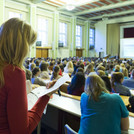 This image shows students in a full lecture hall. 