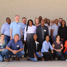 Group picture of participants of the NamTip Stakeholder Workshop in front of a neutral background
