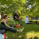 Katrina Schlunke teaches a seminar on the lawn of the University of Potsdam
