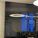 University logo, a seminar room mirrored in it