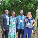 the scientists standing in front of trees