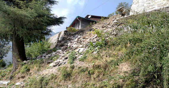 View of a smaller, older landslide that caused a retaining wall to collapse