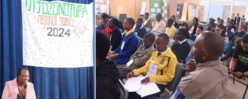 Moderator standing on stage with a microphone in front of a banner saying "Otjozondjupa regional science fair 2024" and audience composed of learners and accompanying educators