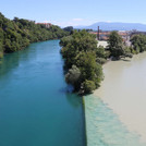 Confluence of Rhone and Arve, whitish water of Arve mixing with clear water of the Rhone, view from above